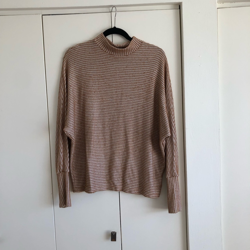 Out from under turtle neck sweater